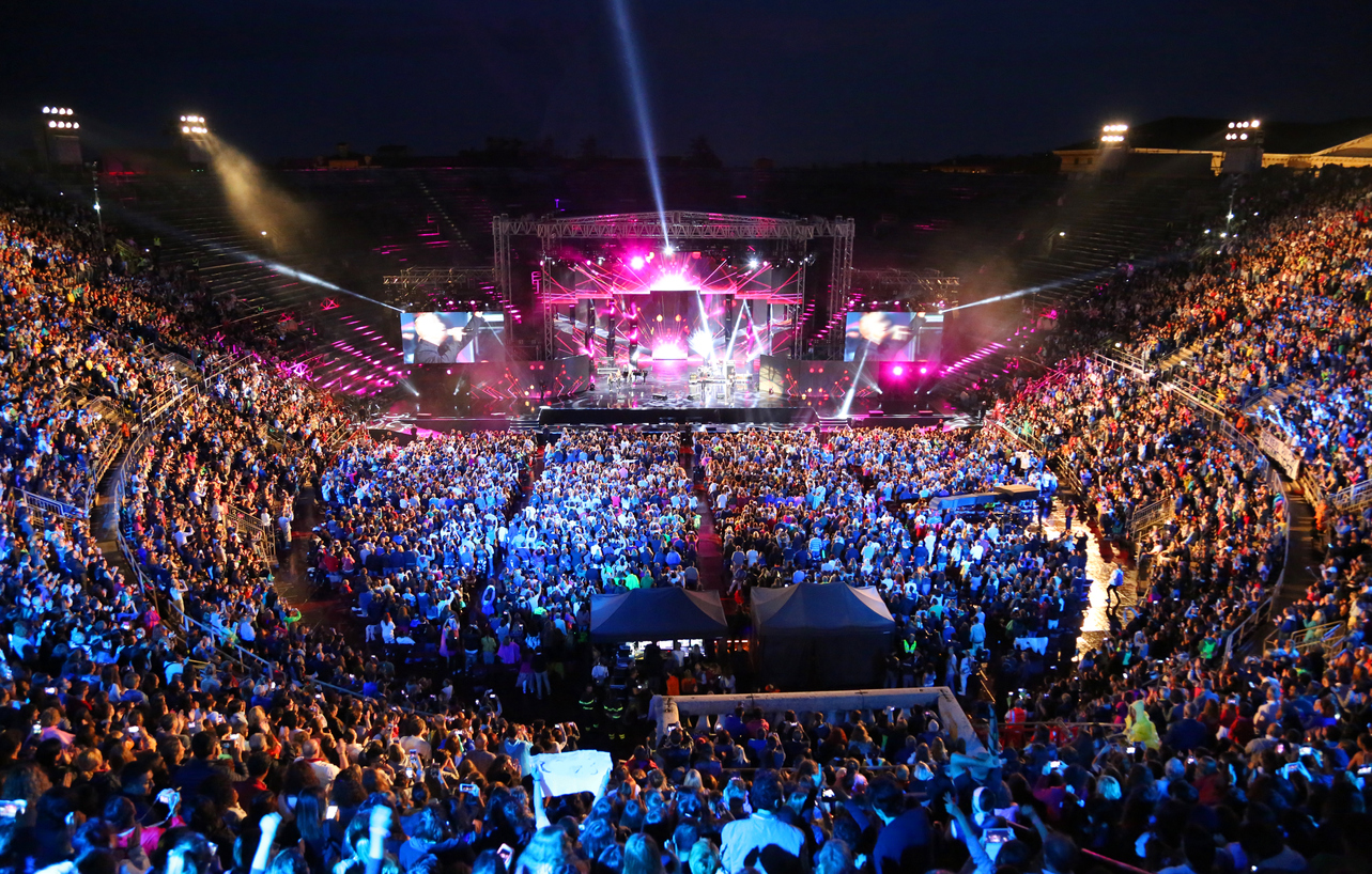 Live concert inside the Arena with people and stage